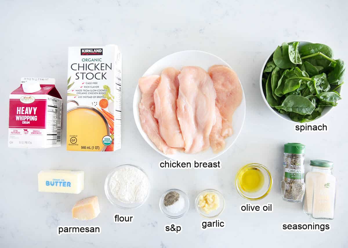 Chicken Florentine ingredients on a marble countertop.