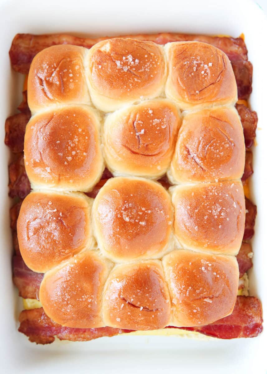 Breakfast sliders in white baking dish.