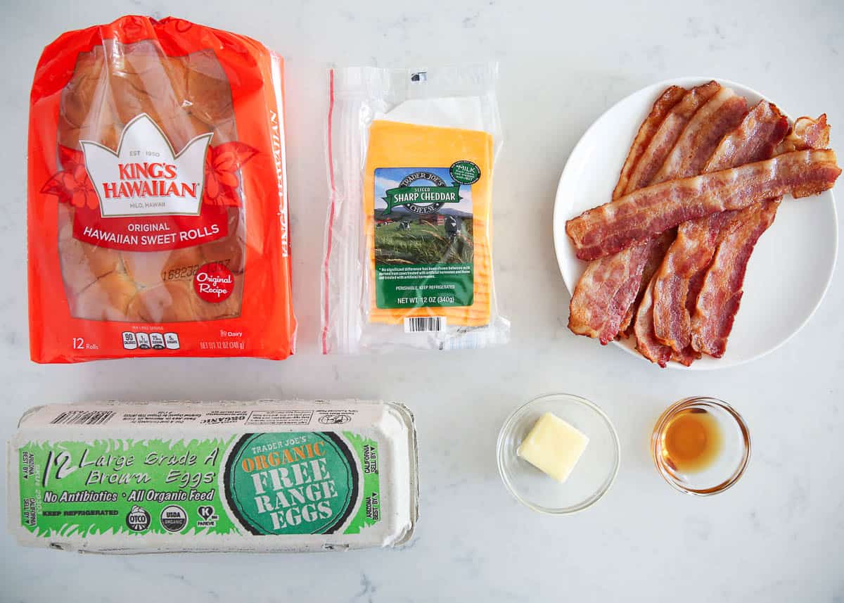 Breakfast slider ingredients on marble counter.