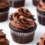 Chocolate cupcake with chocolate cupcake and chocolate sprinkles.