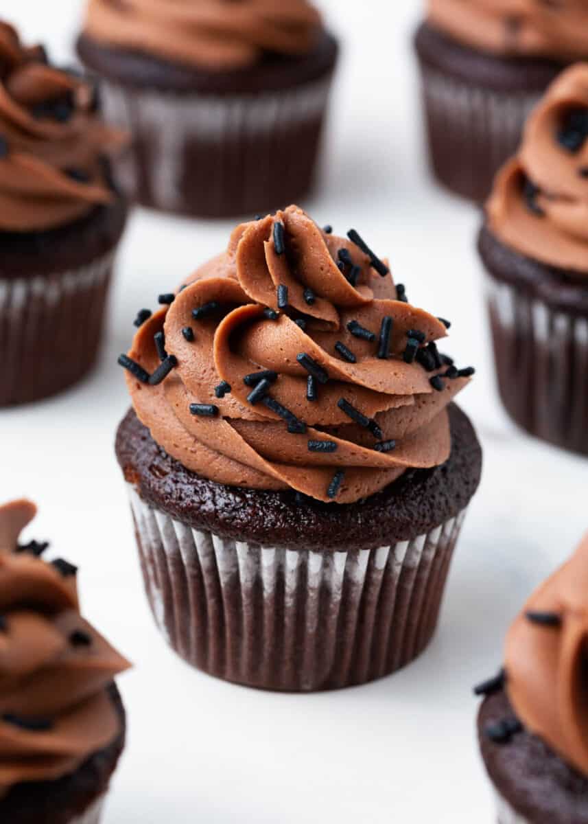 Chocolate cupcake with chocolate cupcake and chocolate sprinkles.
