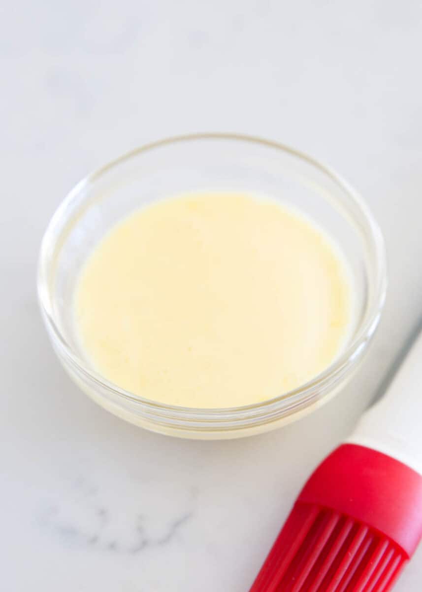 Egg wash in a glass bowl.