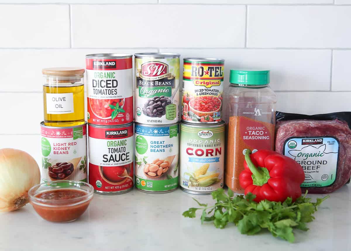 taco soup ingredients on a marble counter.