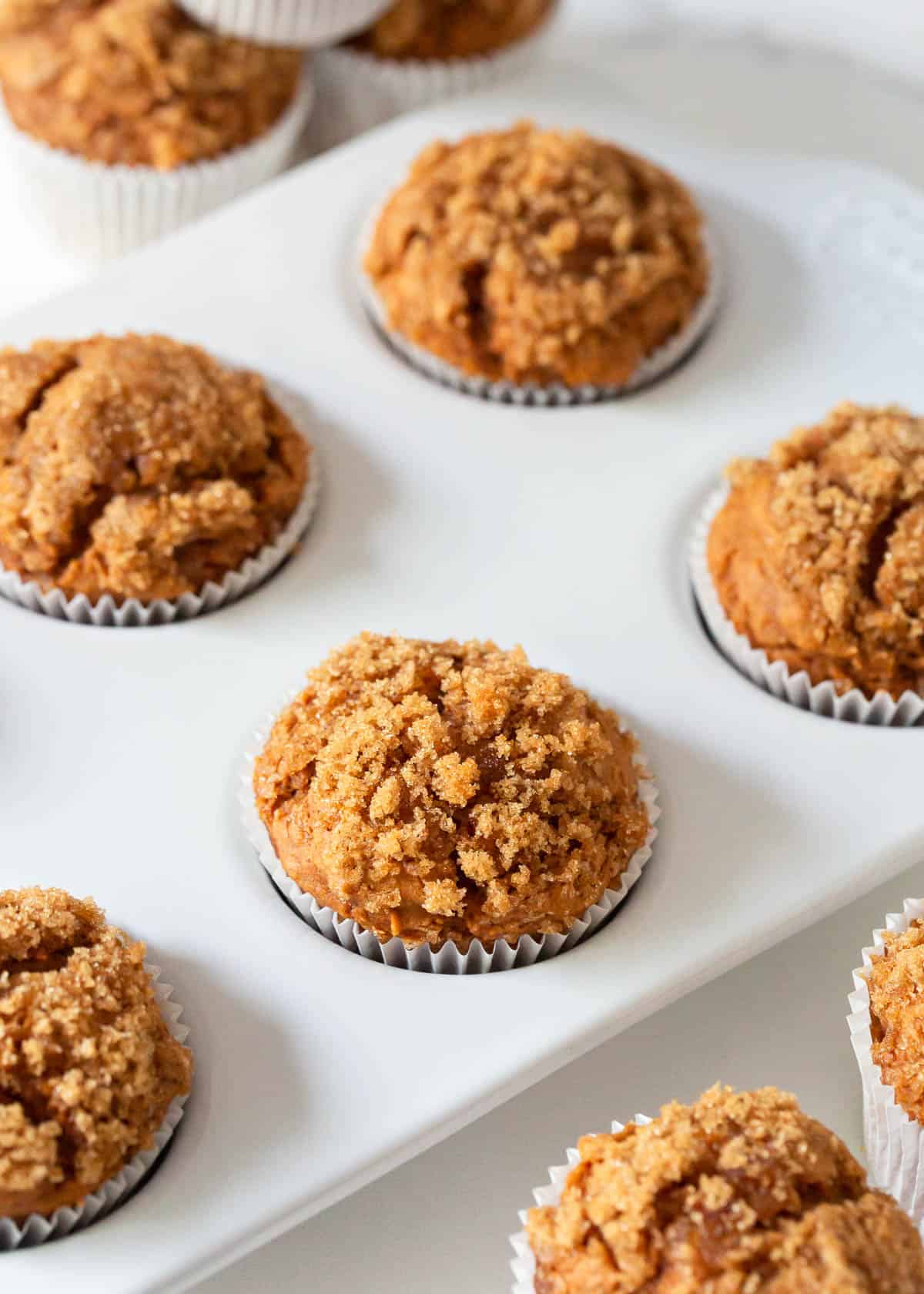 Pumpkin muffins made with a cake mix in muffin pan.