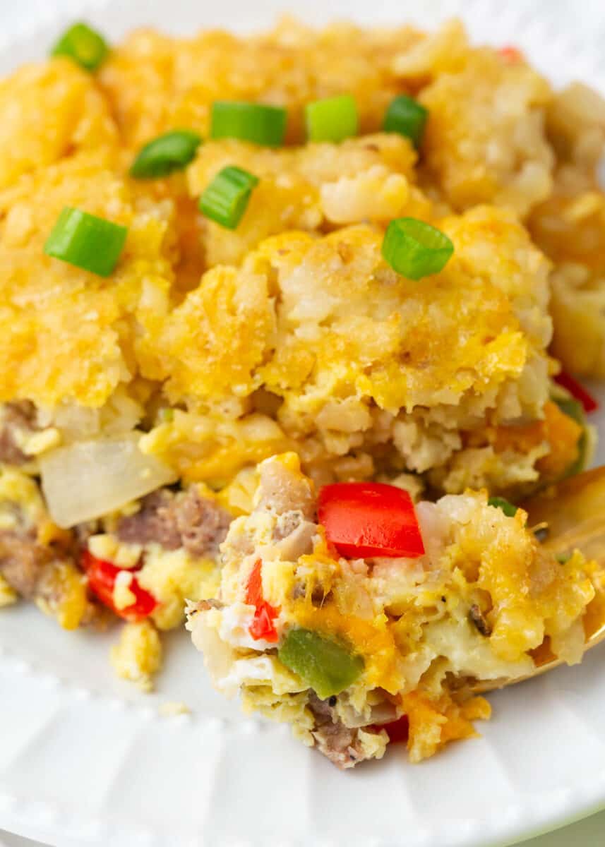 Tater tot breakfast casserole on a white plate.