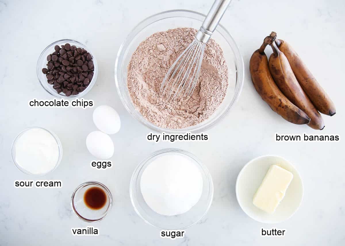 Chocolate banana bread ingredients on a marble counter.