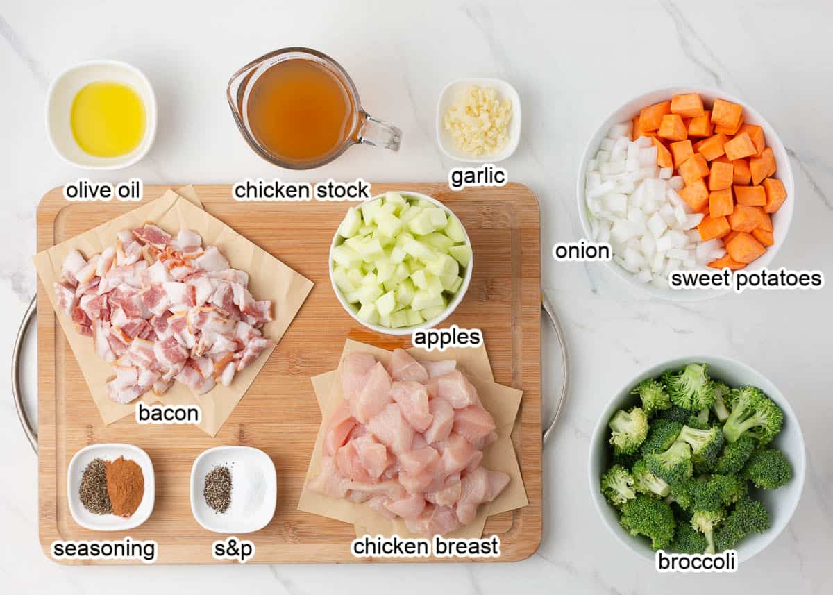 Chicken and apple ingredients on marble counter.
