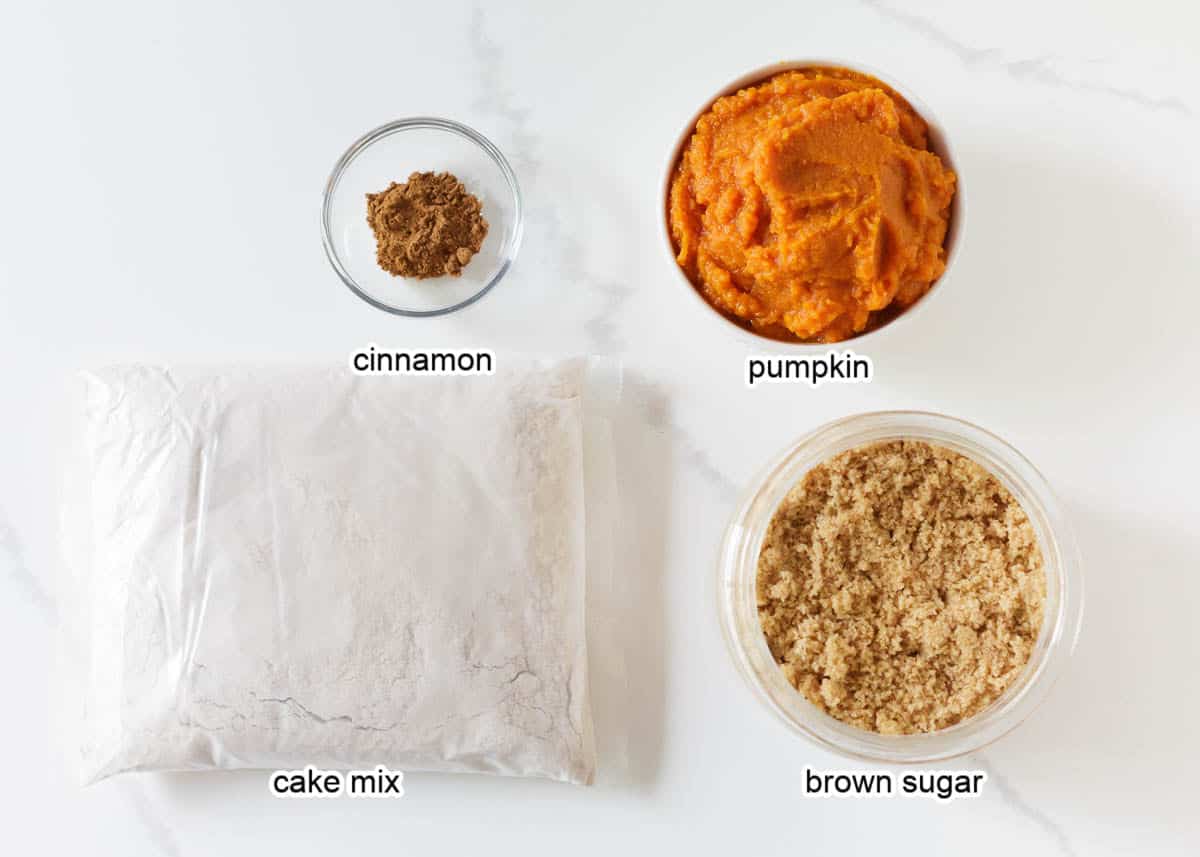 Pumpkin cake mix muffin ingredients on counter.