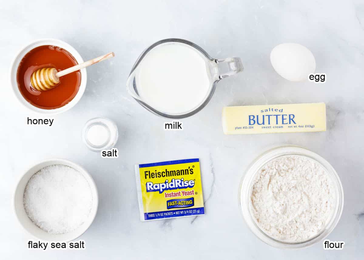 Parker house roll ingredients on marble counter top.