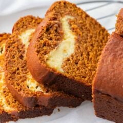 The best pumpkin cream cheese bread sliced on a plate.