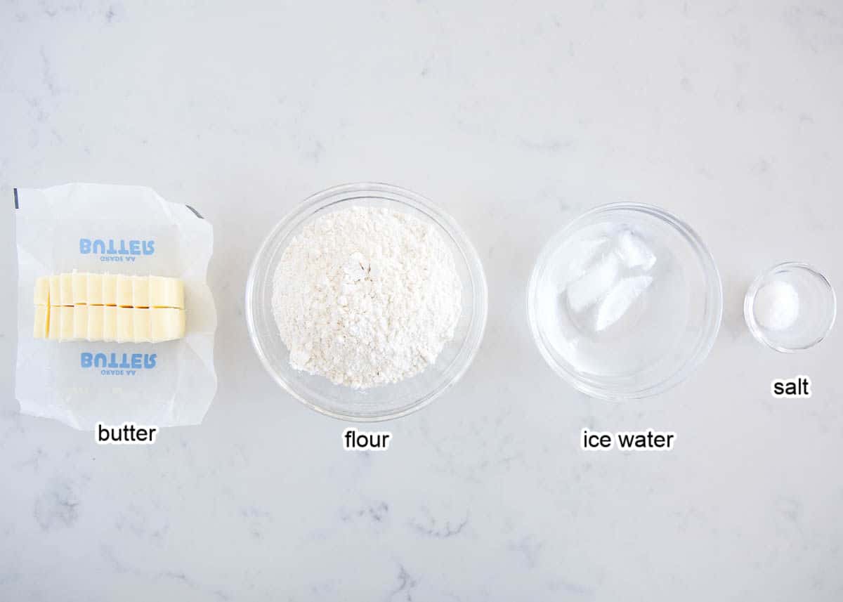 All butter pie crust ingredients on marble countertop. 