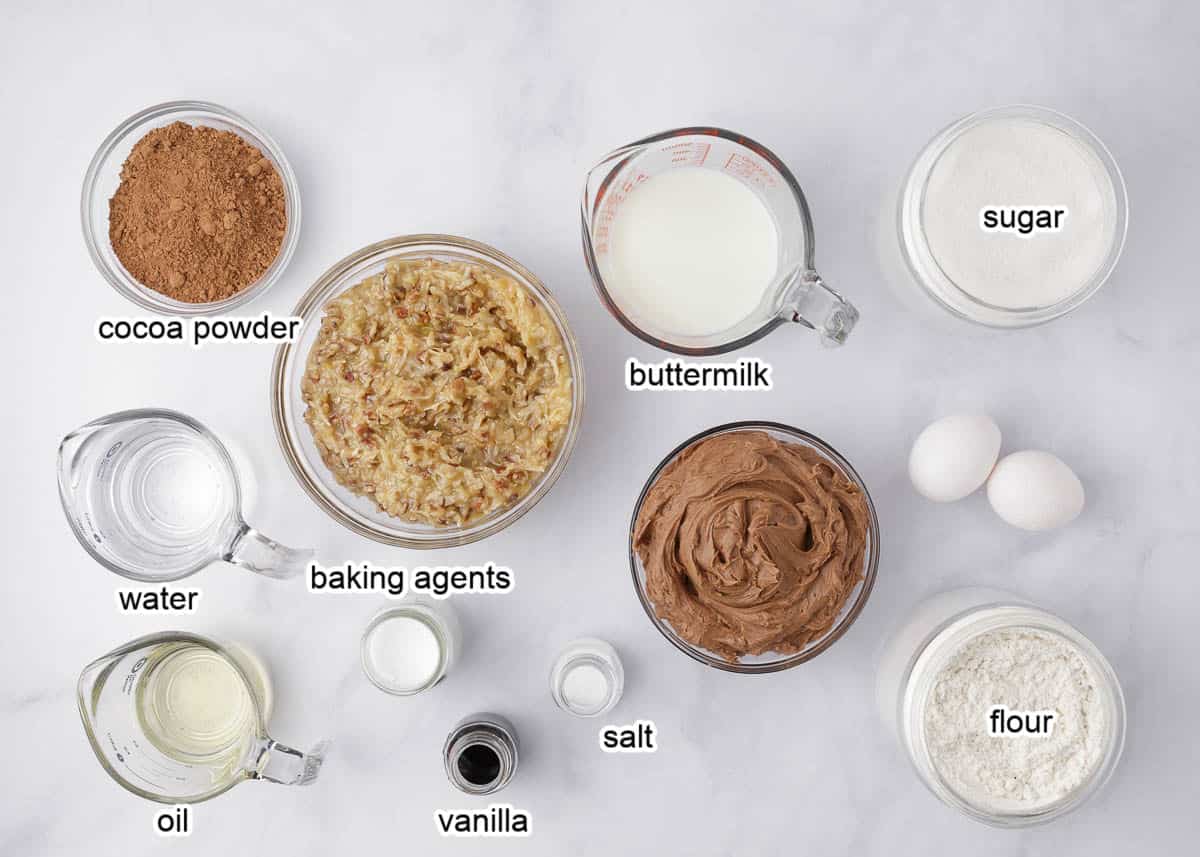 German chocolate cake ingredients on a marble counter.