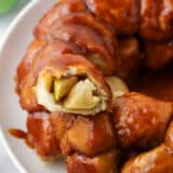 Apple monkey bread piece on a white plate.