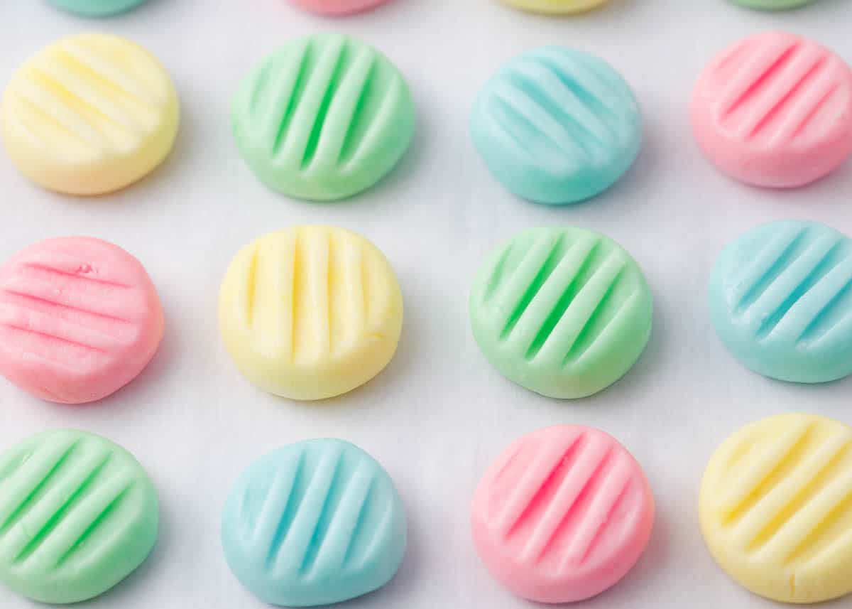 Cream cheese mints on parchment paper.