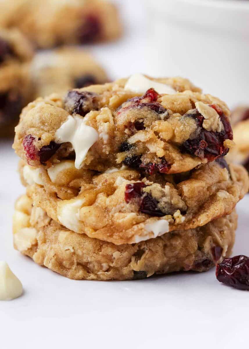 Stack of oatmeal cranberry cookies on a white plate.