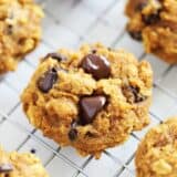 Pumpkin oatmeal chocolate chip cookies on cooling rack.