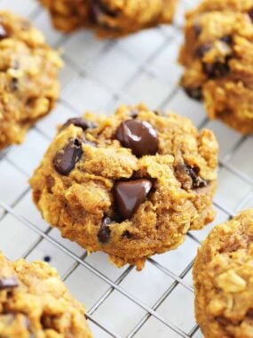 Pumpkin oatmeal chocolate chip cookies on cooling rack.