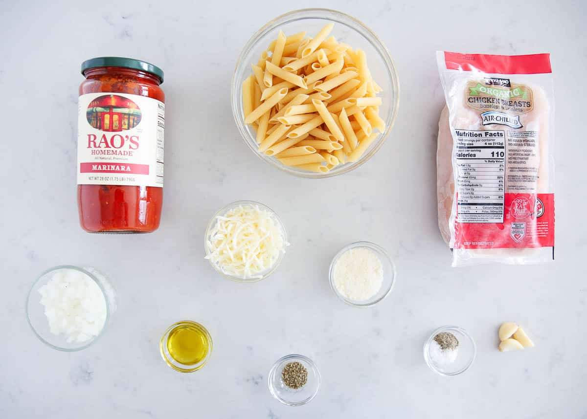 One pot chicken parmesan pasta ingredients on counter. 