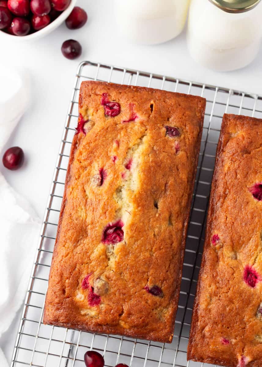 Cranberry banana bread on a cooling rack.