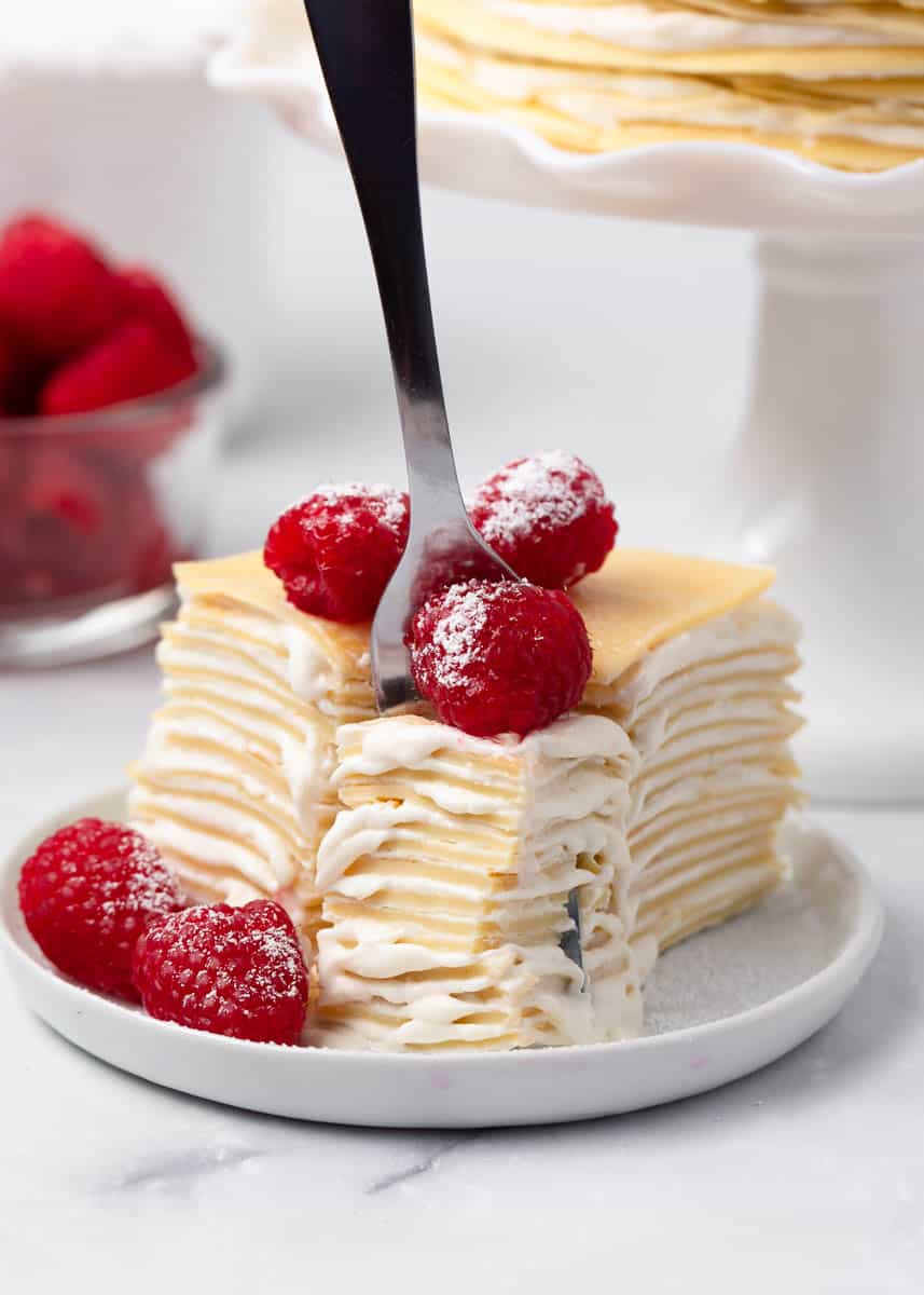 Putting fork into the crepe cake.