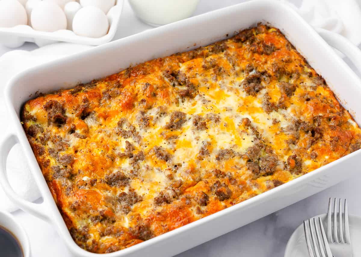 Crescent roll breakfast casserole baked in white dish.