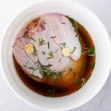 Turkey brining in a white bucket.