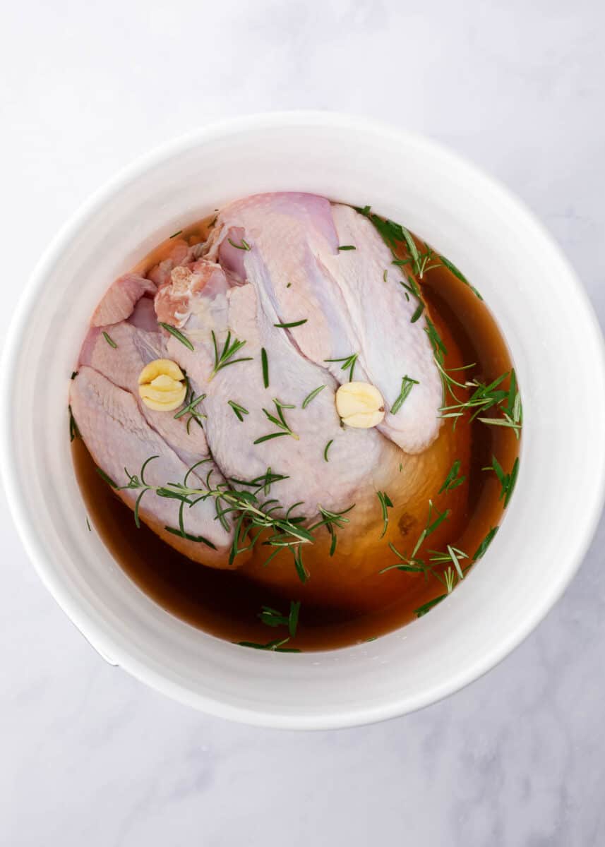 Turkey brining in a white bucket.