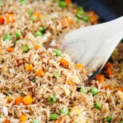 Spoonful of fried rice in a skillet.