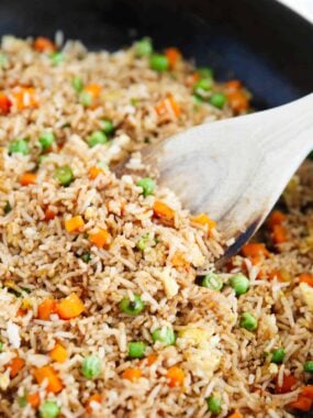 Spoonful of fried rice in a skillet.