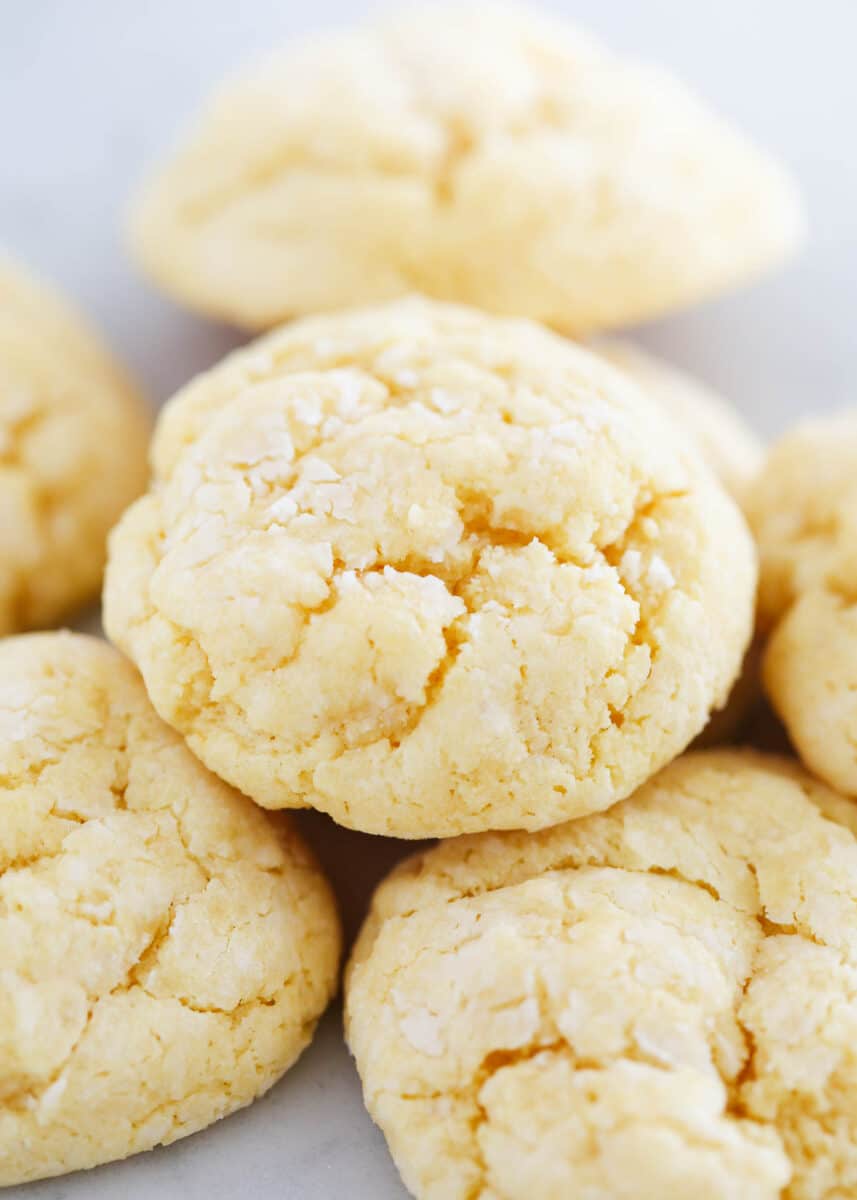 Stacked gooey butter cookies on countertop.