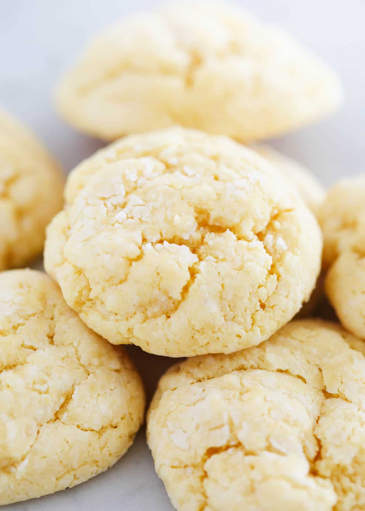 Stacked gooey butter cookies on countertop.