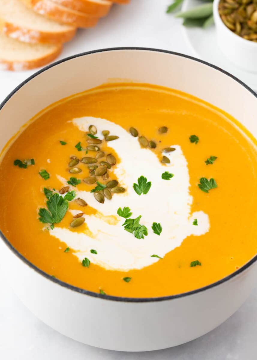 Sweet potato soup in a white pot.