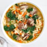 Italian Wedding soup in a white bowl.