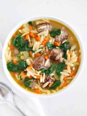 Italian Wedding soup in a white bowl.