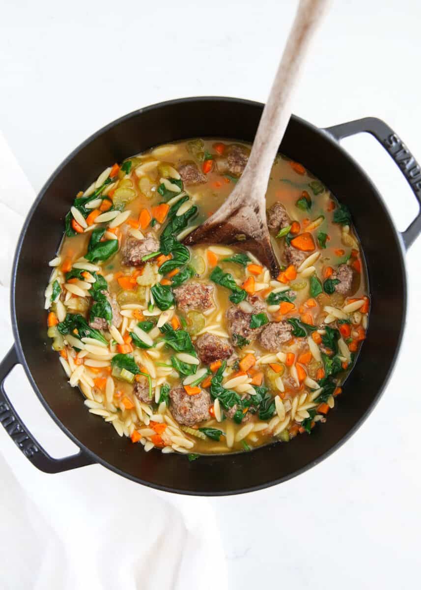 Italian Wedding soup in a black pot.