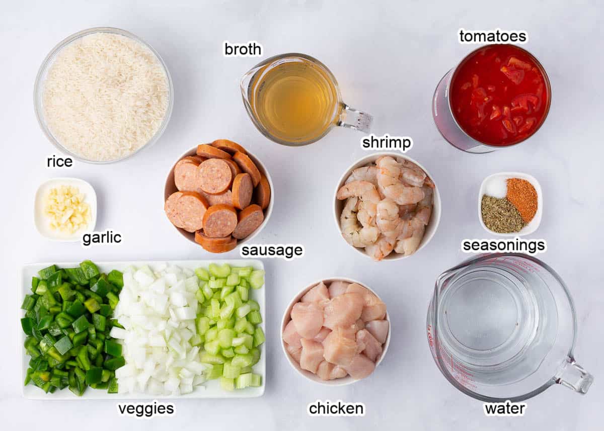 Jambalaya ingredients on a marble counter.