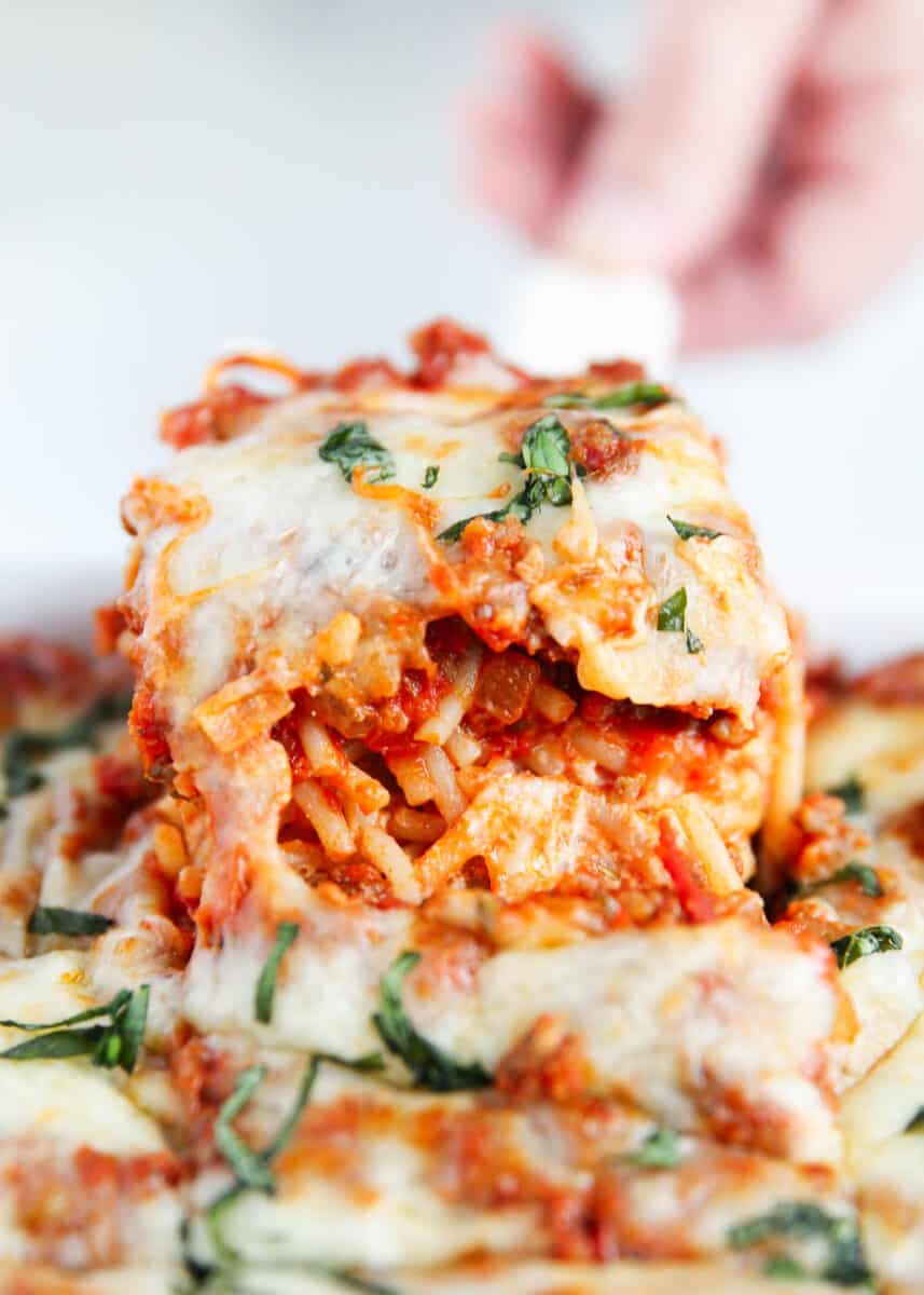 Everyone runs to the table when million dollar spaghetti casserole is on the menu! In under 1 hour, this baked pasta dish made with layers of cooked spaghetti, meat sauce, and cheesy goodness will have everyone happy and satisfied! Slice of million dollar spaghetti casserole.