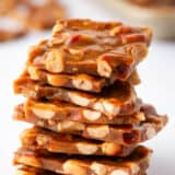 Stack of peanut brittle on a white counter.