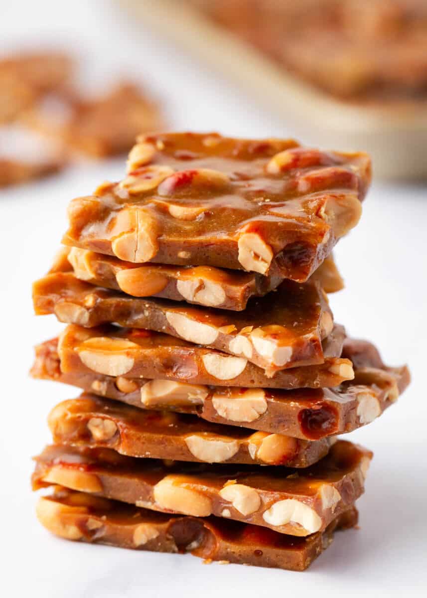 Stack of peanut brittle on a white counter.