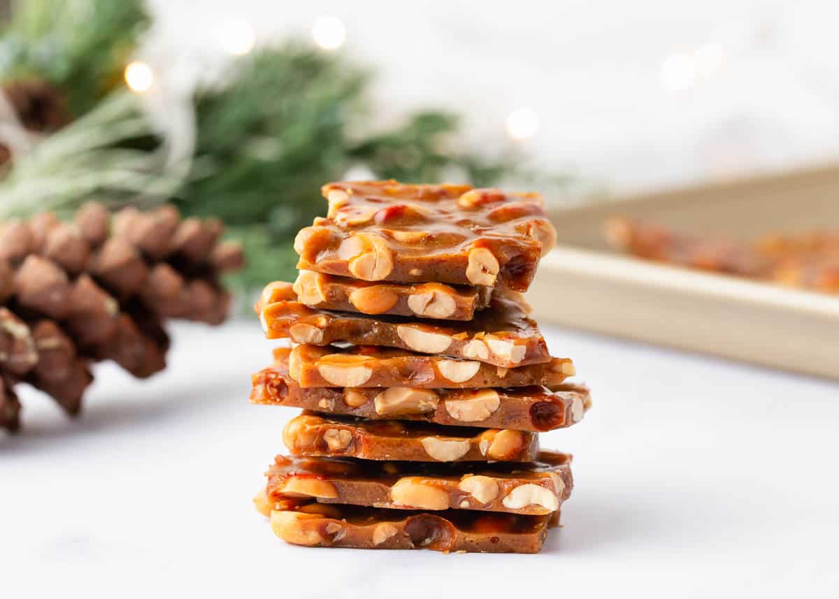 Stacked peanut brittle on a countertop.