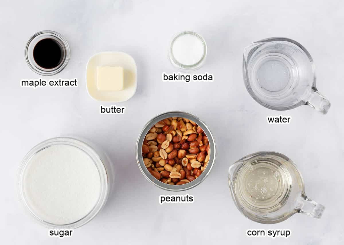 Peanut brittle ingredients on a marble countertop.