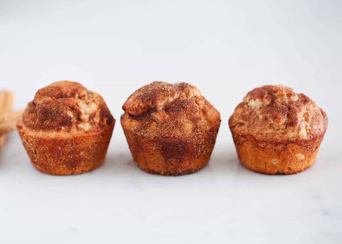 Snickerdoodle muffins on countertop.