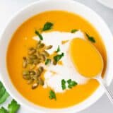 Sweet potato soup in a white bowl.