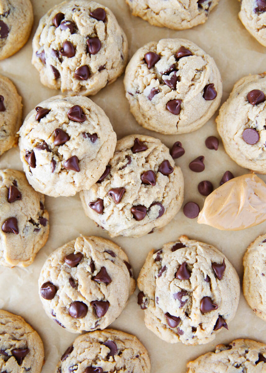 Peanut butter chocolate chip cookies on a piece of parchment paper.