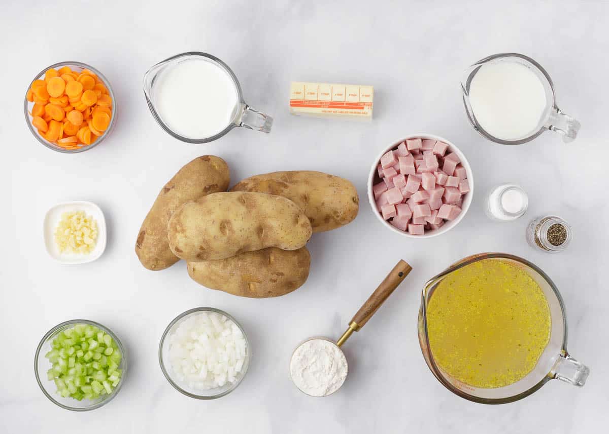 Ham and potato soup ingredients on the counter. 