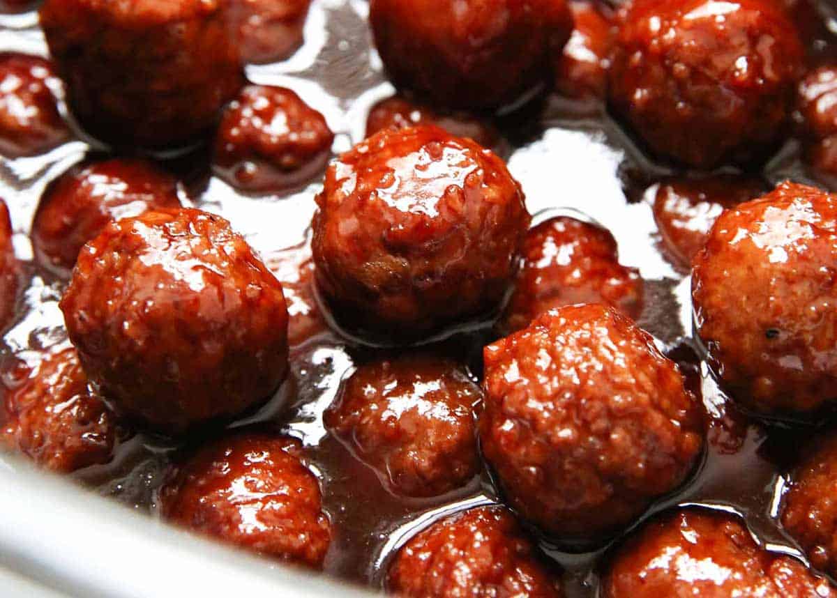 Meatballs cooking in the crockpot. 