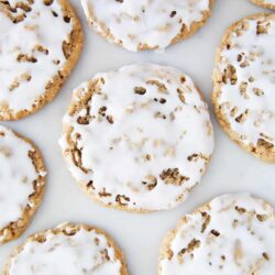 Iced oatmeal cookies on the counter.