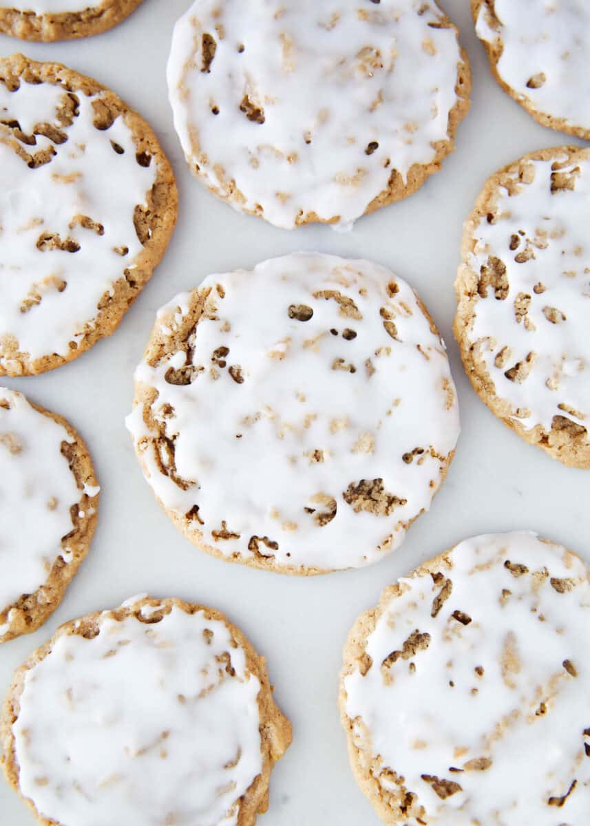 Iced oatmeal cookies on the counter.