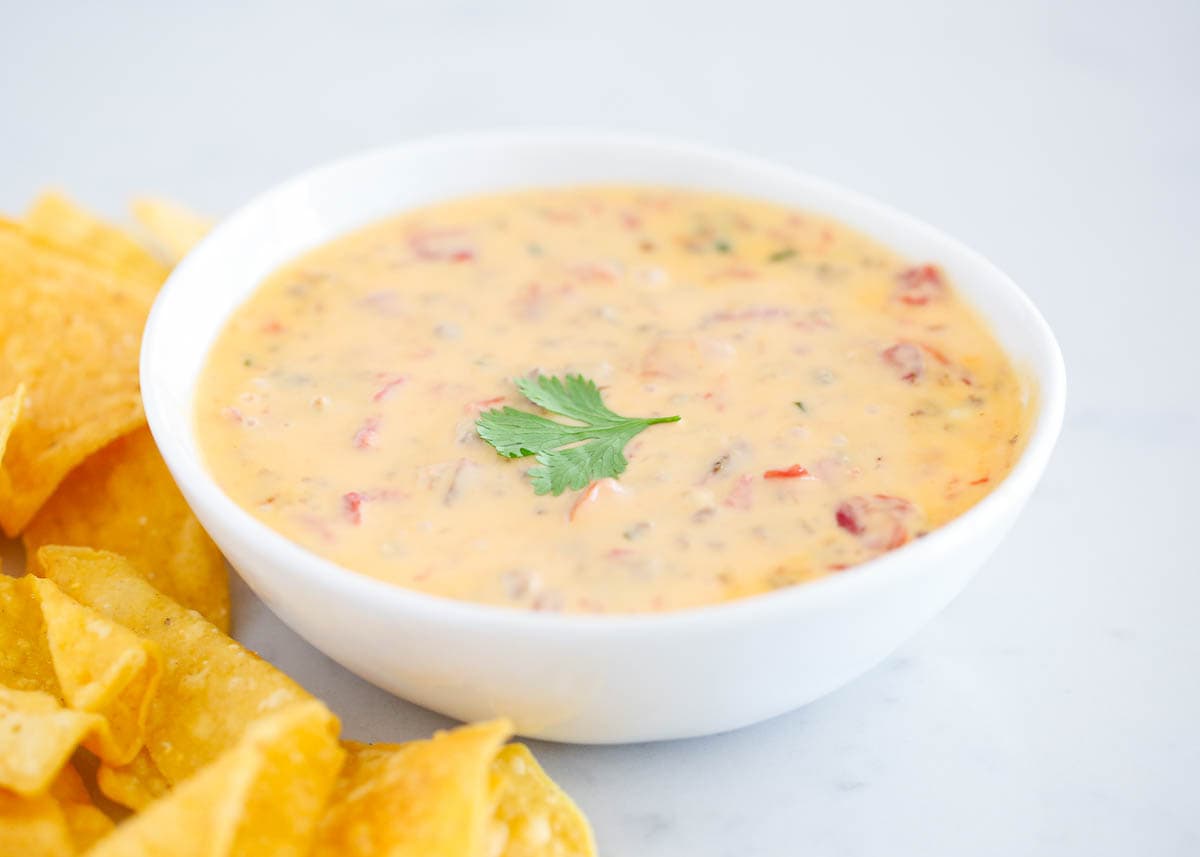 Rotel dip in a white bowl.
