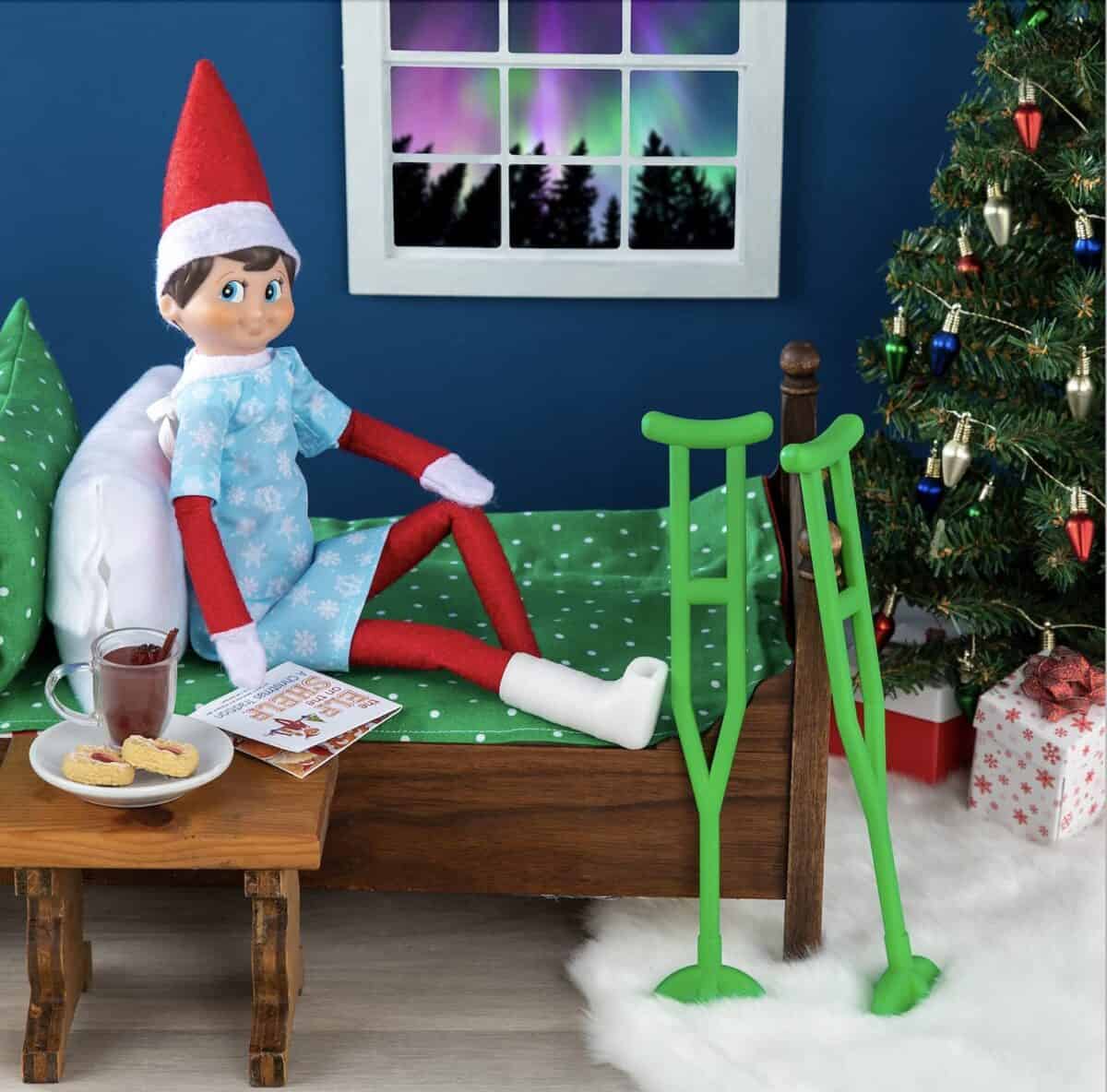Elf sitting with a broken leg. 